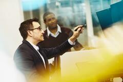 Two men working together in an office