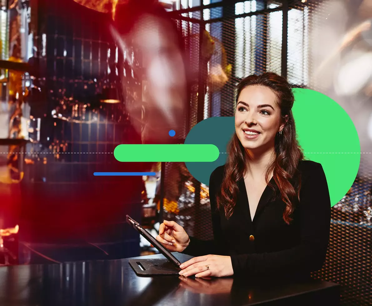 smiling female standing beside a counter table in a restaurant